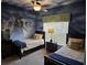 Two twin beds in a themed bedroom with pirate mural and built-in closet at 8955 Coco Palm Rd, Kissimmee, FL 34747