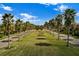 Palm tree-lined entrance to the community at 8955 Coco Palm Rd, Kissimmee, FL 34747