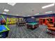 Community game room with two pool tables and arcade games at 8955 Coco Palm Rd, Kissimmee, FL 34747