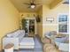 Relaxing patio with seating area and ceiling fan at 8955 Coco Palm Rd, Kissimmee, FL 34747