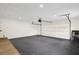 Spacious garage with painted block walls and dark gray epoxy floors at 1238 Cheetah Trl, Winter Springs, FL 32708