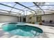 Inviting pool and spa with screened enclosure and comfortable seating at 1238 Cheetah Trl, Winter Springs, FL 32708