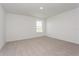 Bright bedroom with neutral walls and carpet at 1304 Silo Dr, St Cloud, FL 34771
