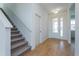 Bright entryway with tile flooring, staircase, and interior door at 1304 Silo Dr, St Cloud, FL 34771