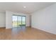 Living room with sliding glass doors and lake view at 1304 Silo Dr, St Cloud, FL 34771