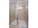 Large walk-in shower with neutral tile at 1304 Silo Dr, St Cloud, FL 34771