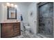 Updated bathroom with a walk-in shower, new vanity, and modern fixtures at 1415 Park Ave, Tavares, FL 32778