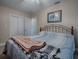 Main bedroom with a king-size bed and an ensuite bathroom at 1415 Park Ave, Tavares, FL 32778