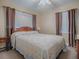 Cozy bedroom with a double bed and ample window light at 1415 Park Ave, Tavares, FL 32778