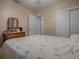 Bright bedroom with a double bed and built-in closet at 1415 Park Ave, Tavares, FL 32778