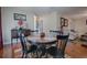 Dining area with dark wood table and chairs and hardwood floors at 1415 Park Ave, Tavares, FL 32778