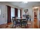 Dining area with dark wood table and chairs near kitchen and entryway at 1415 Park Ave, Tavares, FL 32778