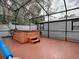 Screened-in hot tub with ample space for relaxation at 1415 Park Ave, Tavares, FL 32778