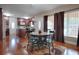 Eat-in kitchen with hardwood floors, granite counters, and dark wood cabinets at 1415 Park Ave, Tavares, FL 32778