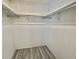 This closet is ready for storage with newly installed laminate flooring at 149 Royal Palm Dr, Leesburg, FL 34748