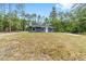 Charming single-story home with a well-maintained lawn and surrounding trees at 15323 Sw 25Th Pl, Ocala, FL 34482