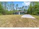 Inviting single-story home with a new concrete driveway and a lush front lawn at 15323 Sw 25Th Pl, Ocala, FL 34482