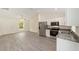 Open-concept kitchen featuring stainless steel appliances and granite countertops at 15323 Sw 25Th Pl, Ocala, FL 34482