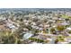 A peaceful residential neighborhood with tree-lined streets, offering a serene living environment at 1613 Cherry Hill Rd, The Villages, FL 32159