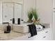 Close up on bathroom single sink vanity with marbled countertops, and decor accents at 1613 Cherry Hill Rd, The Villages, FL 32159