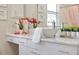 Close up of a bathroom vanity with marble countertop, vessel sink, decorative plants, and fresh towels at 1613 Cherry Hill Rd, The Villages, FL 32159