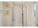 Bathroom shower with sliding glass door and chrome frame at 1613 Cherry Hill Rd, The Villages, FL 32159