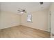 Bedroom featuring a ceiling fan, neutral paint and light wood-look flooring at 1613 Cherry Hill Rd, The Villages, FL 32159