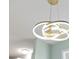 The ceiling fixture is modern and bright with three interlocking lighted rings at 1613 Cherry Hill Rd, The Villages, FL 32159