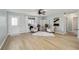 The living room features natural light, modern decor, and comfortable seating arrangements at 1613 Cherry Hill Rd, The Villages, FL 32159