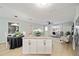 Open floorplan showcases the kitchen island, dining area, and a comfortable seating area at 1613 Cherry Hill Rd, The Villages, FL 32159