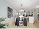 Wide angle view of dining room, living room and kitchen spaces in the house at 1613 Cherry Hill Rd, The Villages, FL 32159