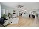 Bright living room that opens to the kitchen and dining room provides a great open floorplan at 1613 Cherry Hill Rd, The Villages, FL 32159