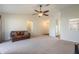 Spacious living room with a leather sofa and open view to kitchen area at 1649 Stanley Ave, Groveland, FL 34736