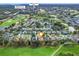 A scenic aerial shot of a residential community close to Mulberry Grove Plaza, Pool and Rec Center at 16814 Se 80Th Bellavista Cir, The Villages, FL 32162