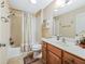 Bathroom featuring a shower-tub combo, a sink with wooden vanity, and tiled floors at 16814 Se 80Th Bellavista Cir, The Villages, FL 32162