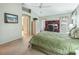 Comfortable bedroom with a built-in desk and storage, plus a view of the backyard at 16814 Se 80Th Bellavista Cir, The Villages, FL 32162