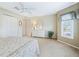 Bright bedroom with neutral carpet, a closet, a ceiling fan, and lots of natural light at 16814 Se 80Th Bellavista Cir, The Villages, FL 32162