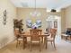 Well-appointed dining room featuring a chandelier, a plant, neutral tones, and archway to entry at 16814 Se 80Th Bellavista Cir, The Villages, FL 32162