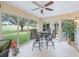 Bright sunroom with a table and chairs, tile floors, and panoramic views of the outdoors at 16814 Se 80Th Bellavista Cir, The Villages, FL 32162