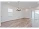 Bright dining area with wood-look tile floors and sliding glass doors at 17006 Clear Mind Aly, Winter Garden, FL 34787