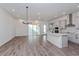 Modern kitchen with island, stainless steel appliances, and gray cabinets at 17006 Clear Mind Aly, Winter Garden, FL 34787