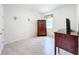 Simple bedroom with wooden furniture and tiled floors at 17313 Blazing Star Cir, Clermont, FL 34714