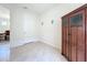 Bright hallway with a wooden cabinet and tiled floor at 17313 Blazing Star Cir, Clermont, FL 34714