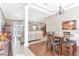 Bright dining room with hardwood floors and view to the kitchen at 177 Boardman Dr, Umatilla, FL 32784