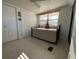 Guest bedroom with daybed and ceiling fan at 1802 Petunia Ln, The Villages, FL 32159