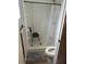 Bathroom with a walk-in shower with a seat and a towel at 188 Hibiscus Way, Leesburg, FL 34748