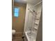 Bathroom featuring a toilet and a tub with shower fixtures at 188 Hibiscus Way, Leesburg, FL 34748