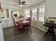 Bright dining area with bay windows and built-in cabinetry at 188 Hibiscus Way, Leesburg, FL 34748