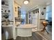 Open kitchen featuring a breakfast bar and modern appliances at 188 Hibiscus Way, Leesburg, FL 34748