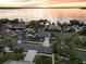 Waterfront homes featuring mature landscaping, private docks, and beautiful lake views at sunset at 2350 Lakeview Ave, Clermont, FL 34711